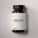 Brown bottle of Shilajit with a white label on a gray background
