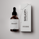Shilajit supplement bottle and packaging on a light gray background